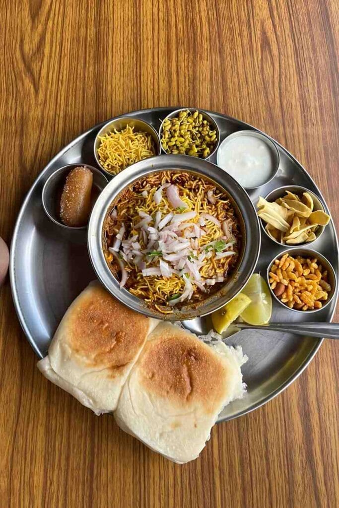 misal-pav-bowl-with-tarri-farsan-lemon-onion-thali